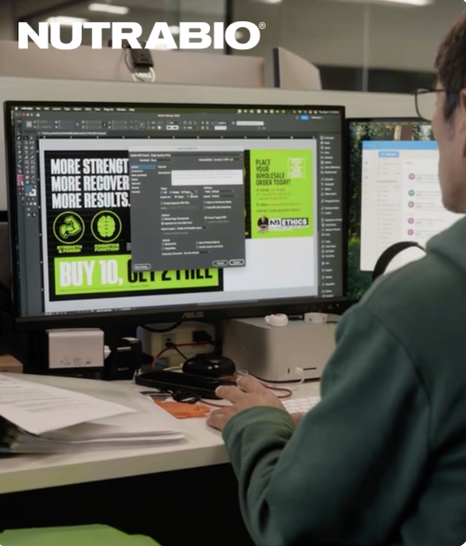 A NutraBio designer reviewing label artwork on screen